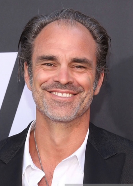 A portrait photograph of Steven Ogg.